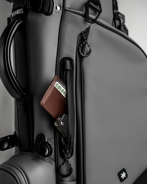 Player Preferred™ Golf Bag in Flat Ash color, showcasing a sleek design with multiple compartments for storage and an adjustable strap.